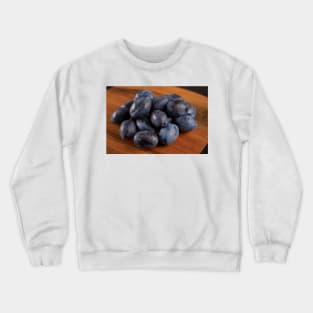 Blue plums in a collander Crewneck Sweatshirt